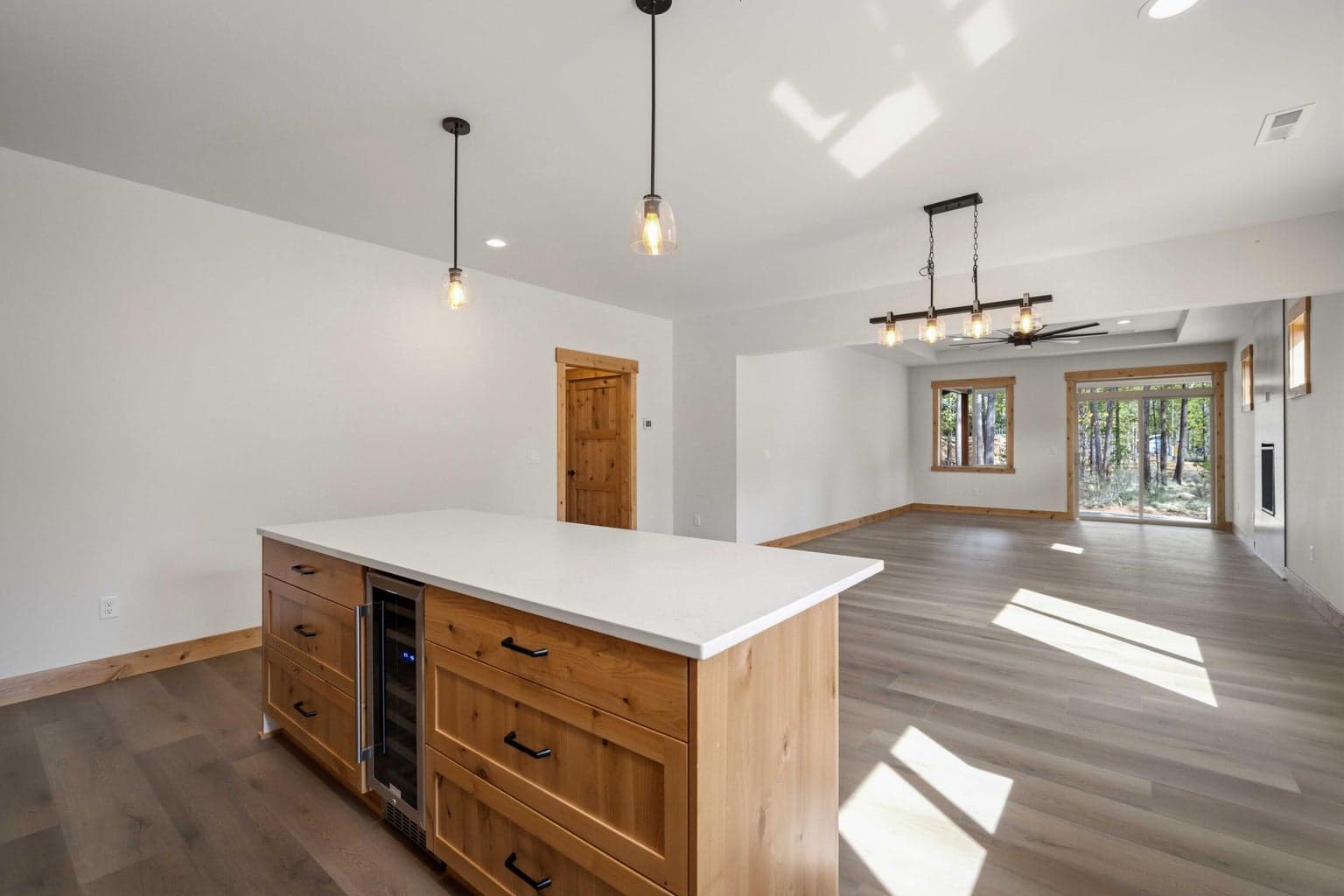 Expansive quartz island opens to the great room, creating an ideal setting for gathering, entertaining, and everyday living.