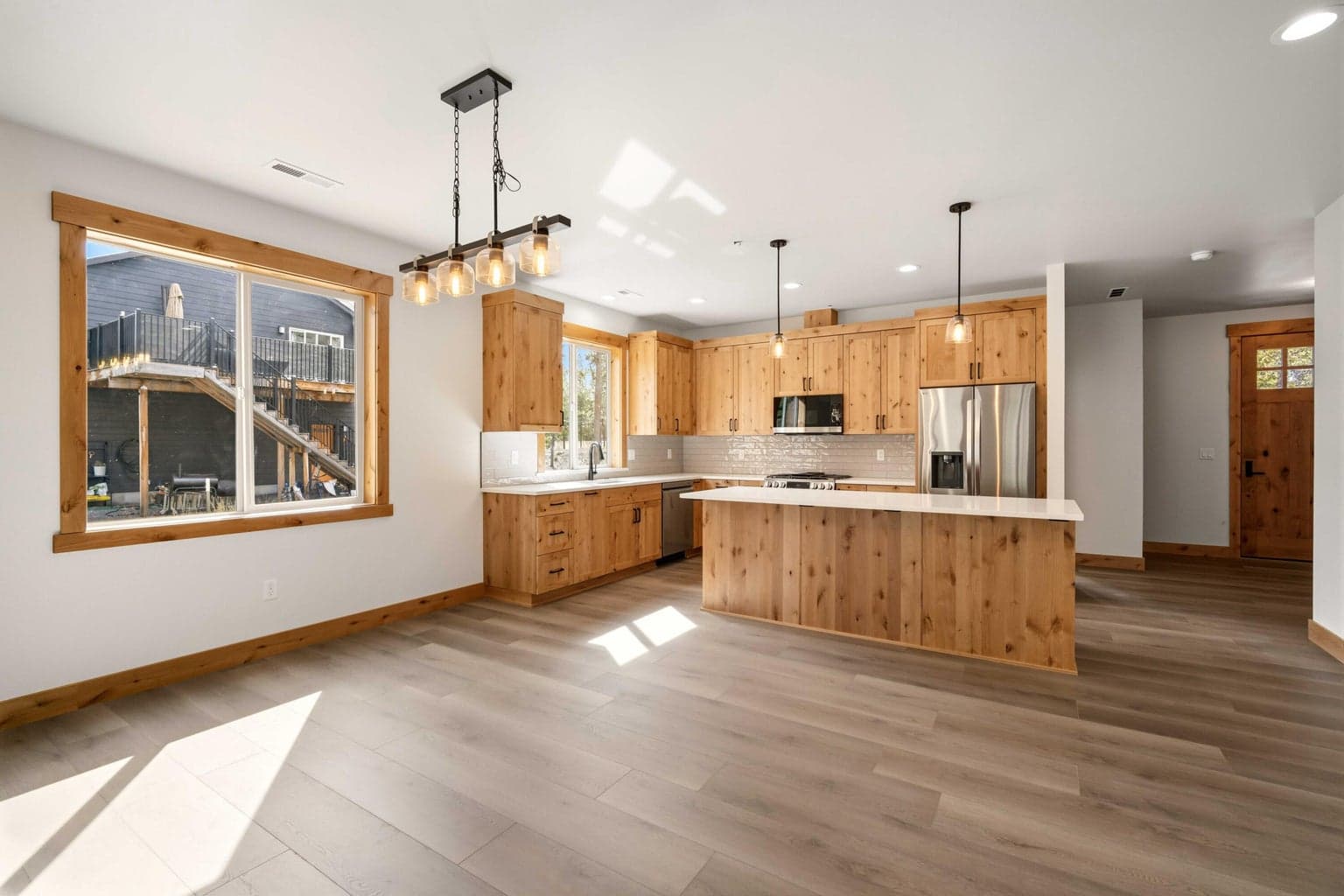 Open-concept design blends kitchen and living spaces beautifully, with abundant light and a layout that lives comfortably.