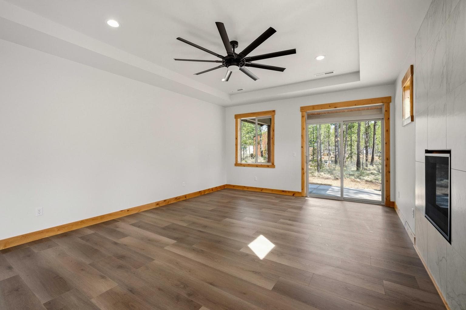 Spacious great room opens to the covered patio and treed setting, creating a relaxed Central Oregon lifestyle feel.