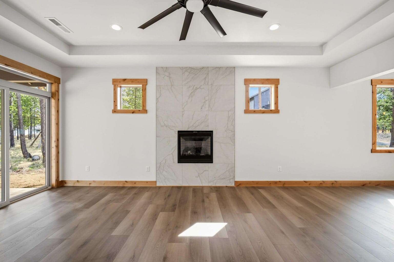 Fireplace wall creates a stylish focal point in the great room, bringing warmth and a clean contemporary finish to the space.