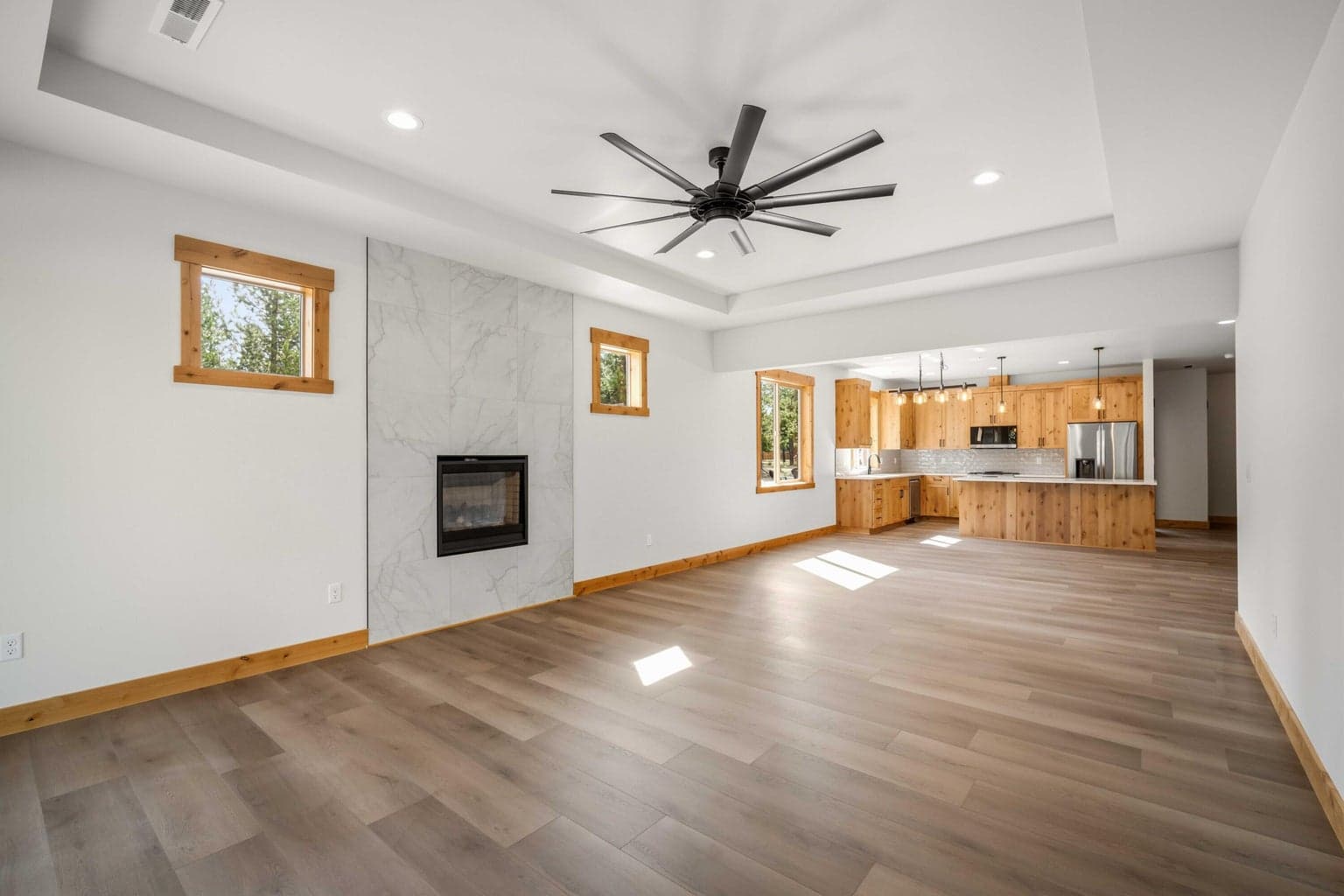 Expansive great room opens seamlessly to the kitchen, offering a bright and comfortable layout for everyday living and entertaining.
