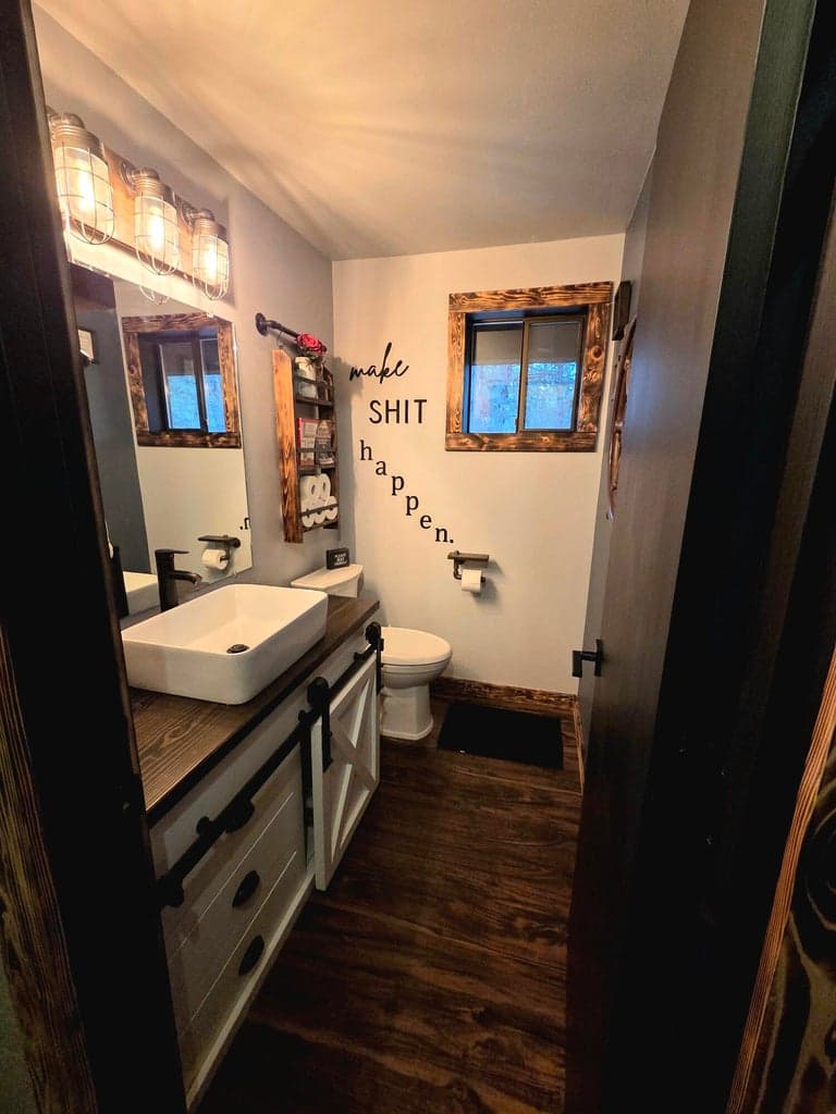 half-bathroom in hall between kitchen and garage