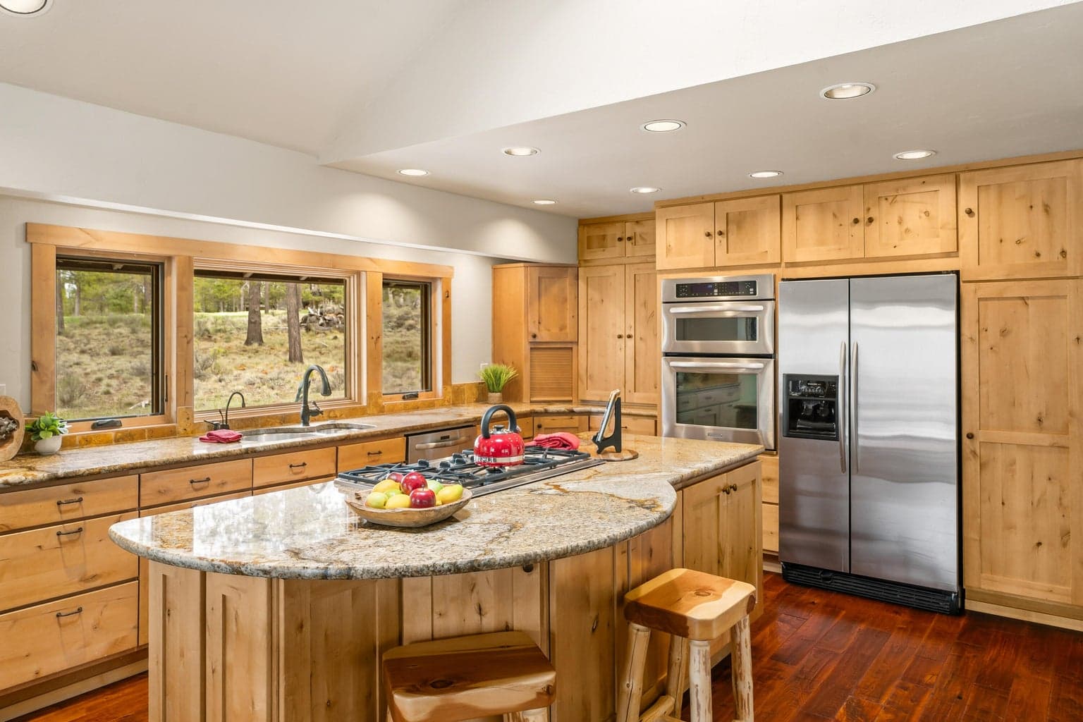 Beautiful knotty pine cabinetry and granite island