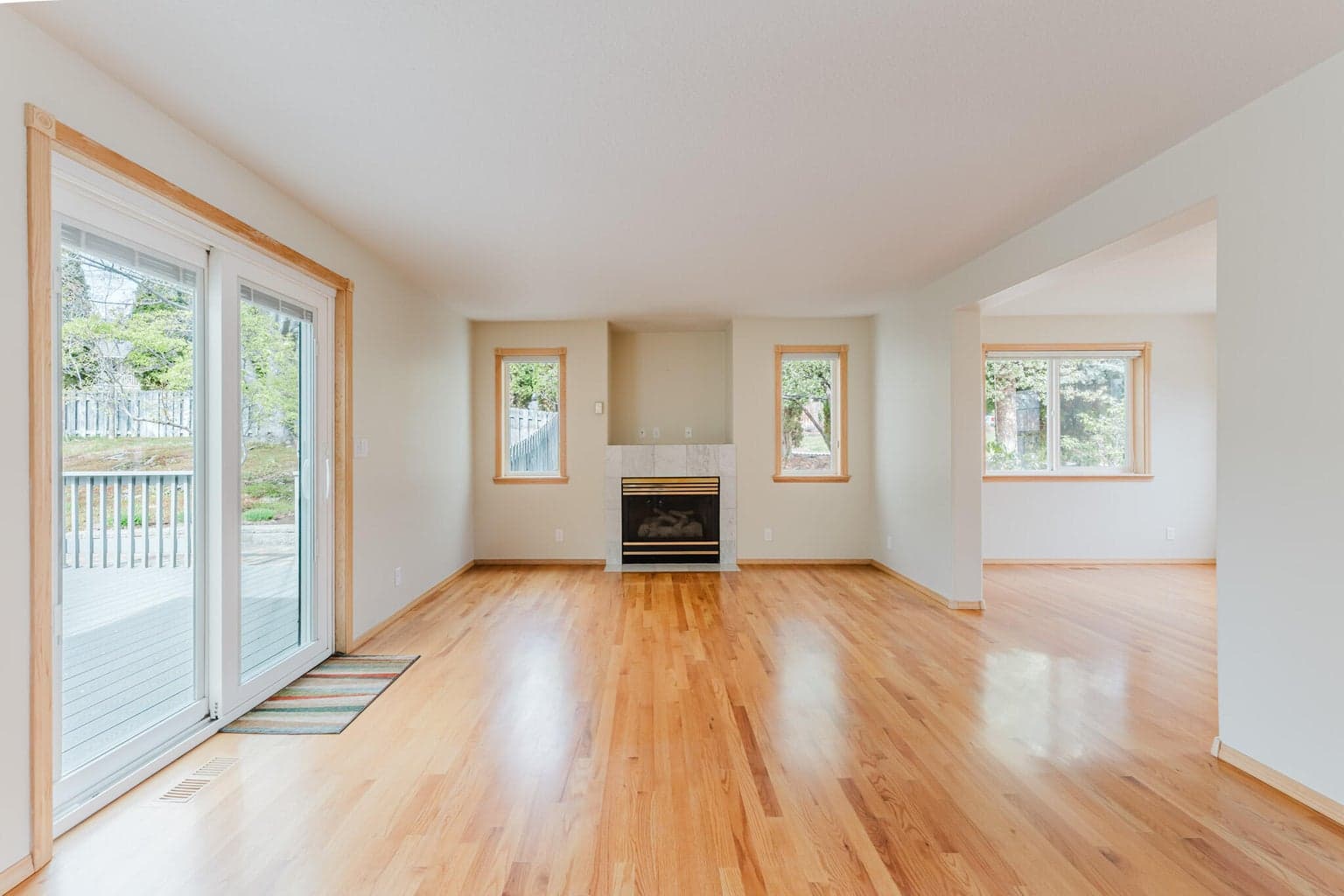Wood floors fill the entry, family room, and front facing room to the west that could be a formal dining, sitting room, living room, your choice!