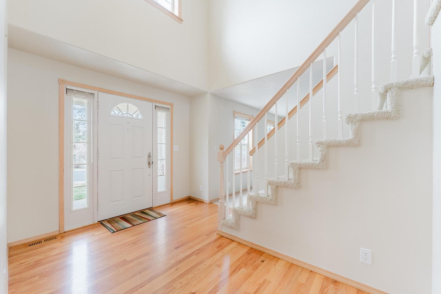 Hardwood floors in the entry and the staircase to the upstairs.