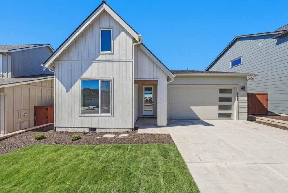 Subject property. Single-level has a faux window in attic.