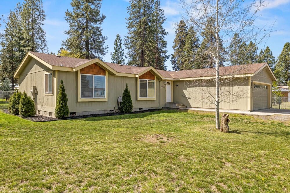 Large front yard with sprinklers