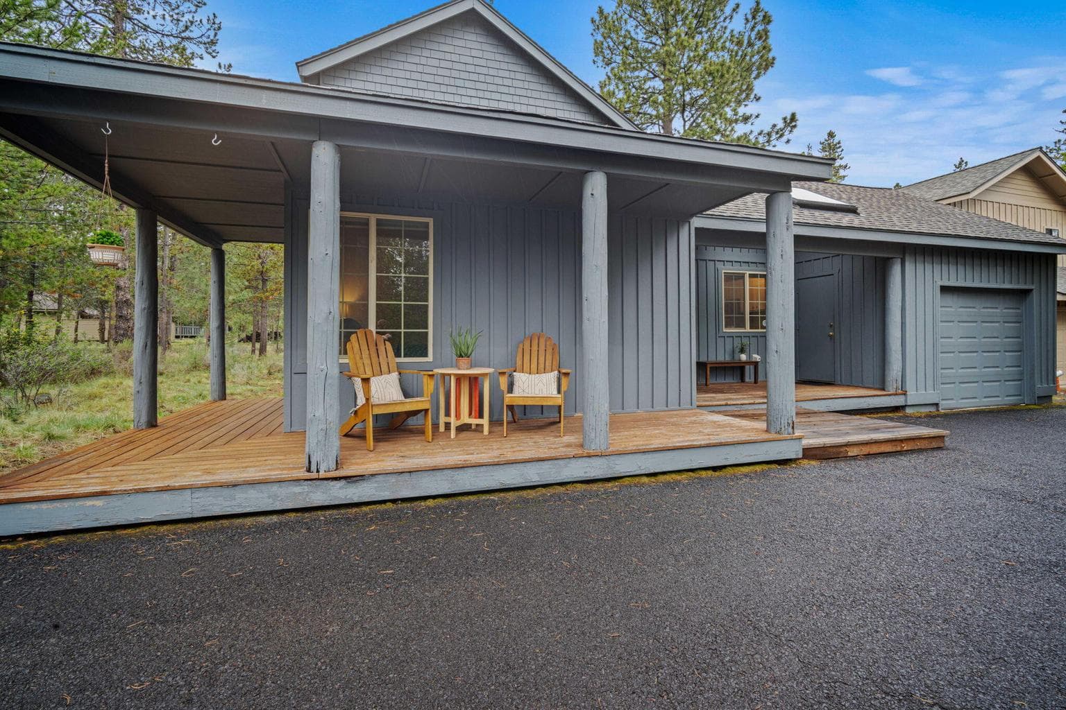 Cozy up under the covered front, wrap around deck for hot cocoa or an evening glass of wine