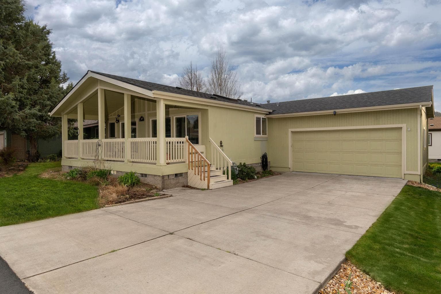 Covered-enclosed-gated front porch offers a lovely welcoming entry for friends and neighbors. It is also a wonderful spot for morning coffee or entertaining.