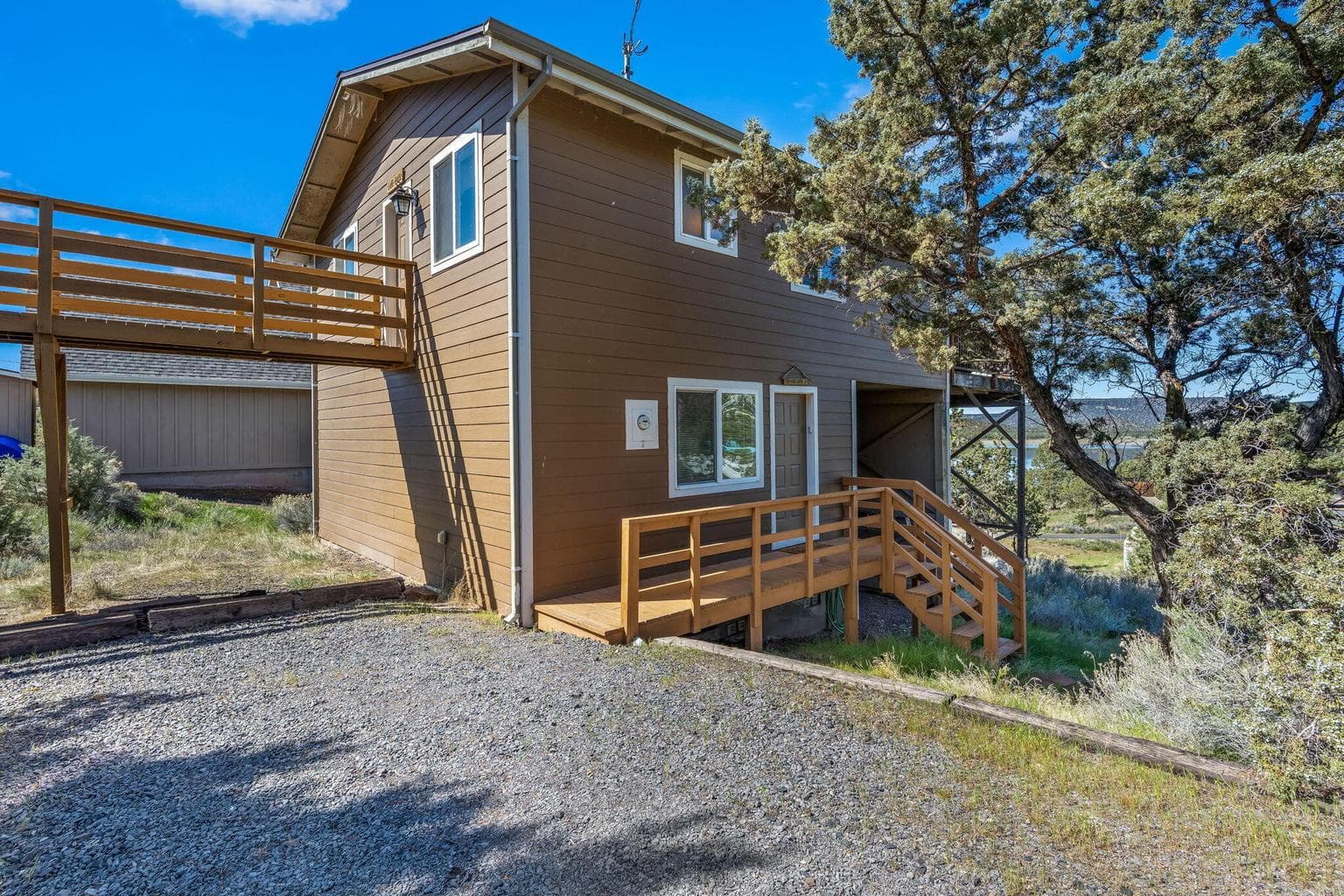 Side profile showing the low-maintenance lot and gated RV parking area.