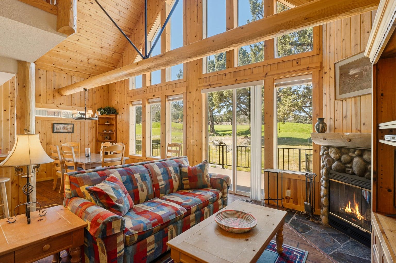Great Room with large windows and Patio door to back deck overlooking golf course