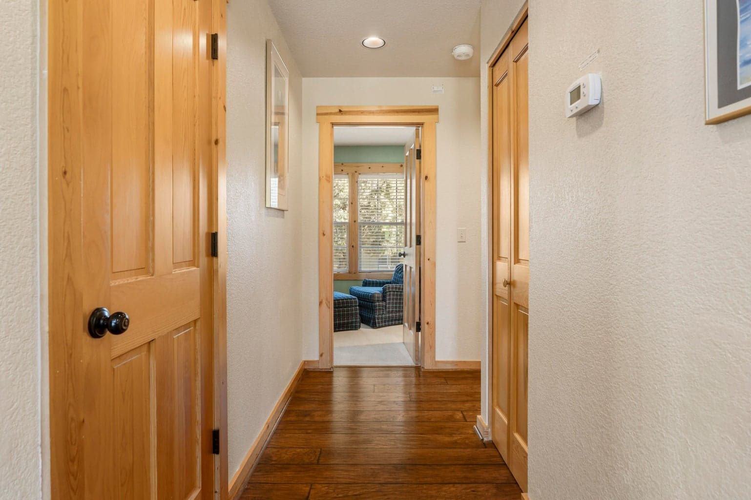 Hallway to primary bedroom on main floor