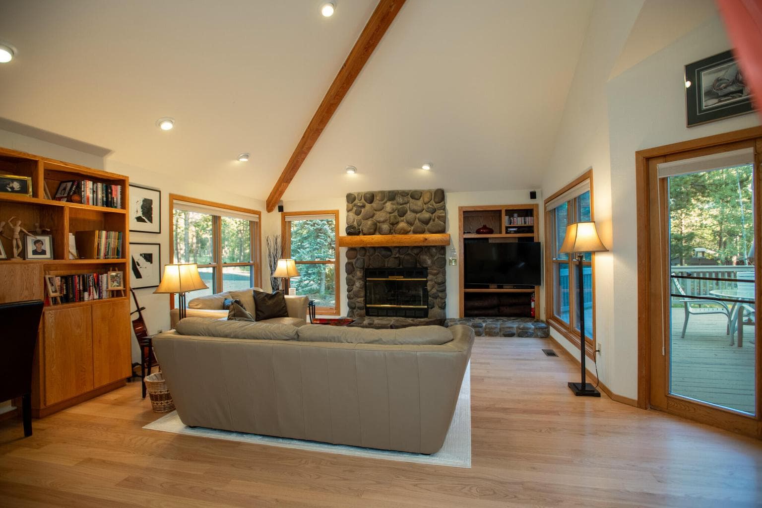 High vaulted ceilings and a built in book shelf.