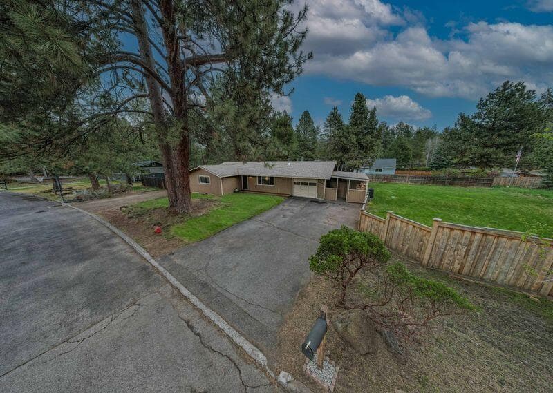 Single level ranch home in SW Bend sitting on a large corner .38/acre lot with lots of room for your toys!