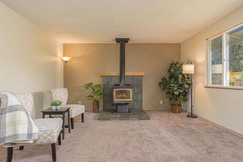 Front living room has an efficient wood burning stove.
