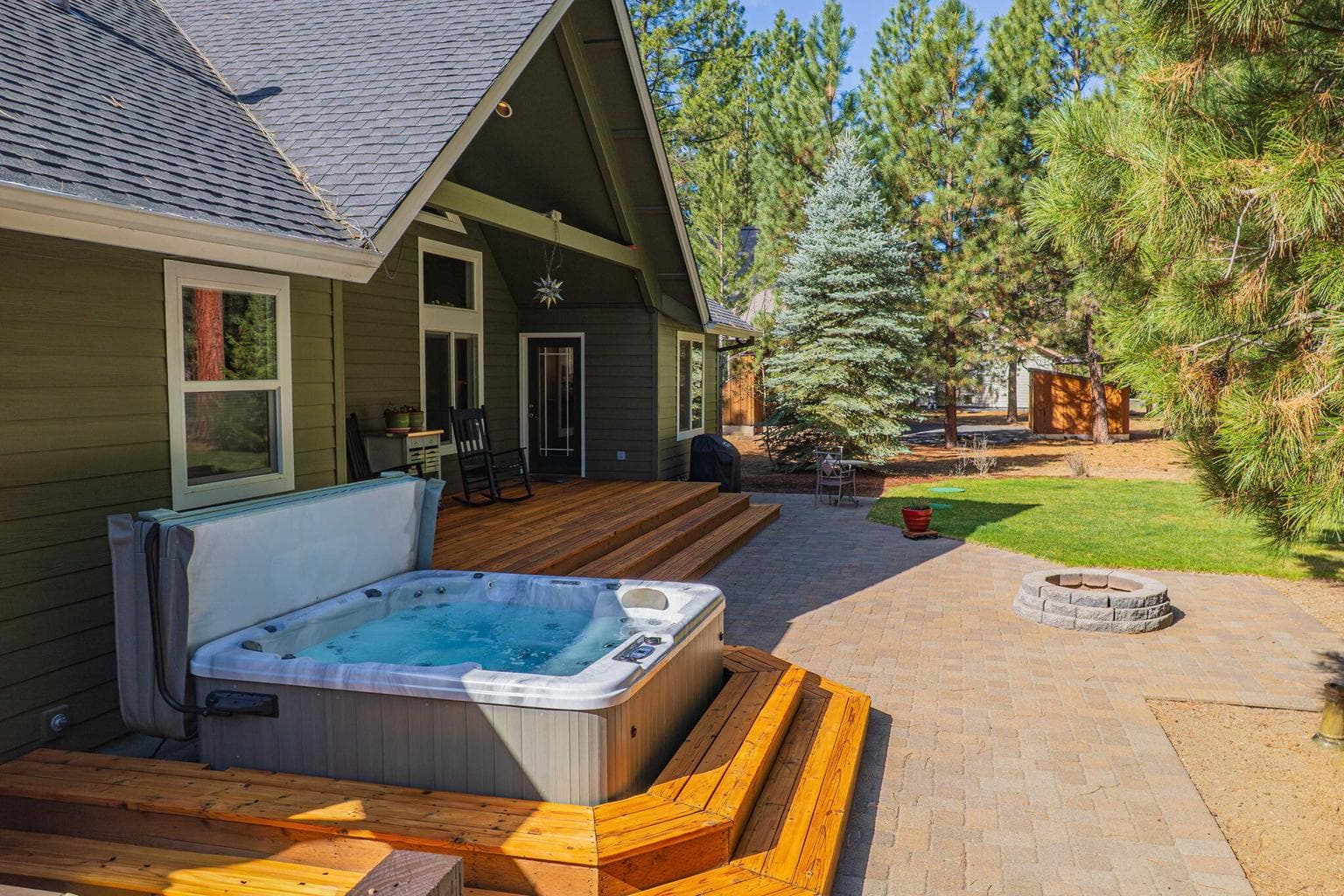 Newer Hot tub (2022) and paver patio with a fire pit