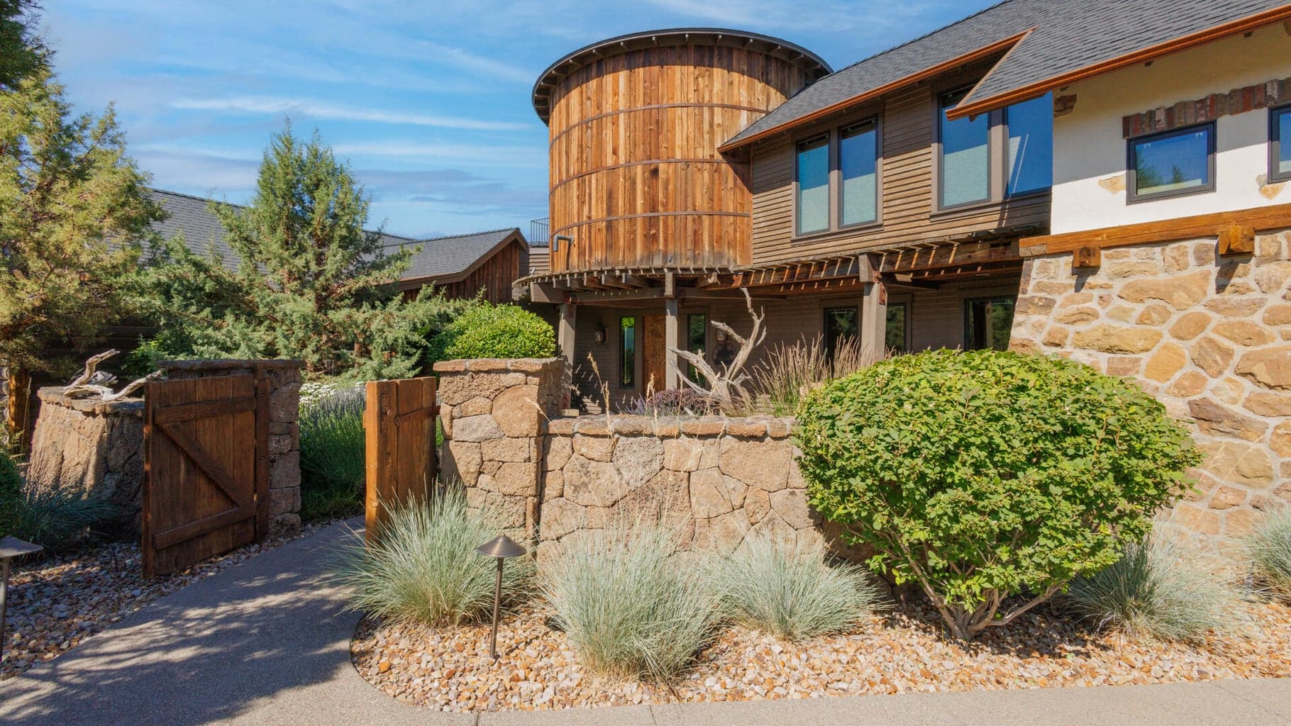 Stone half walls and gated entry