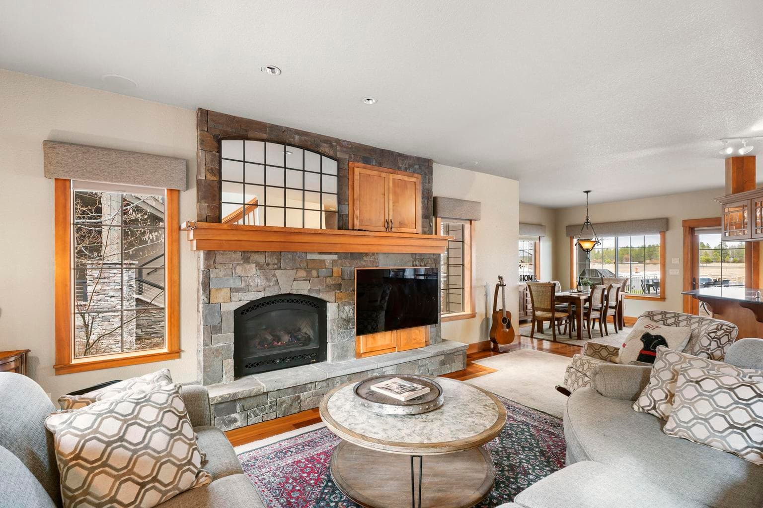 Great room w/ gas fireplace & stacked stone surround.