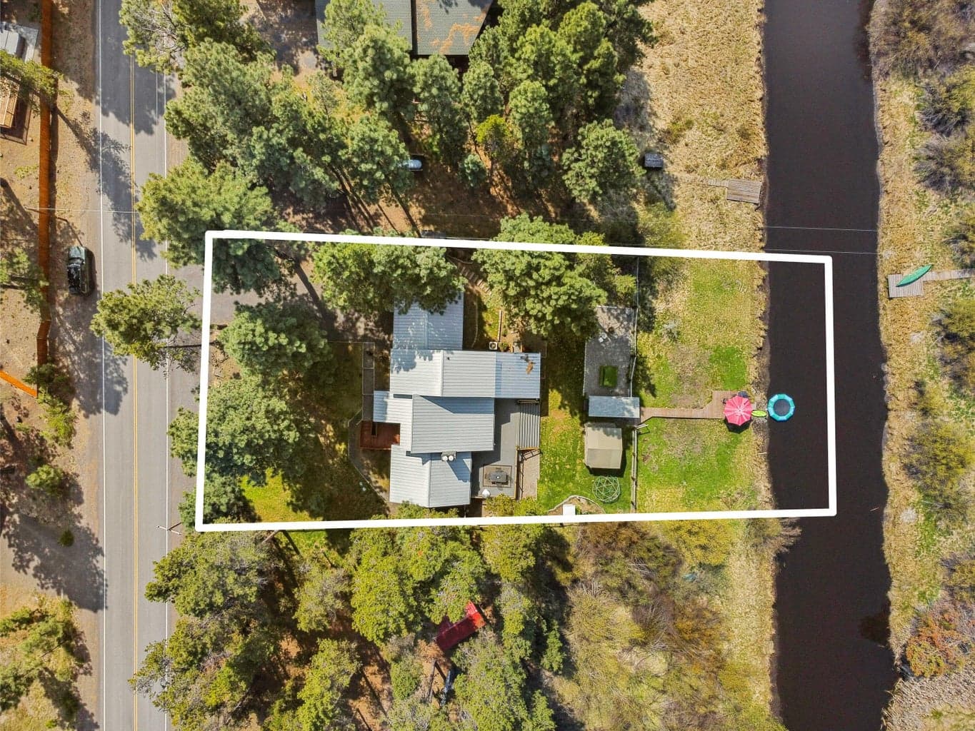 Property positioned along the river with road access and forested privacy