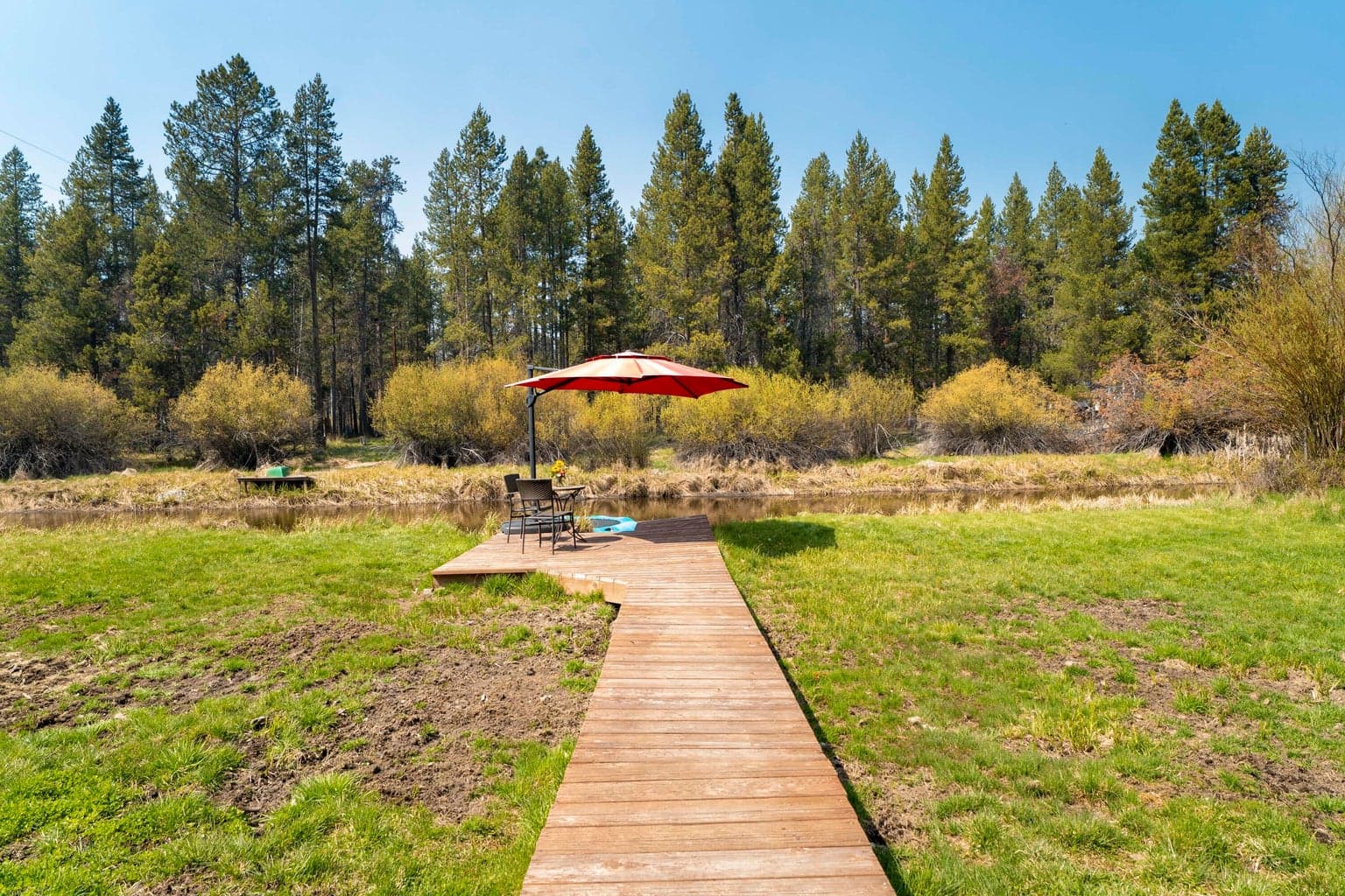 Boardwalk leads from the lawn to the private waterfront seating
