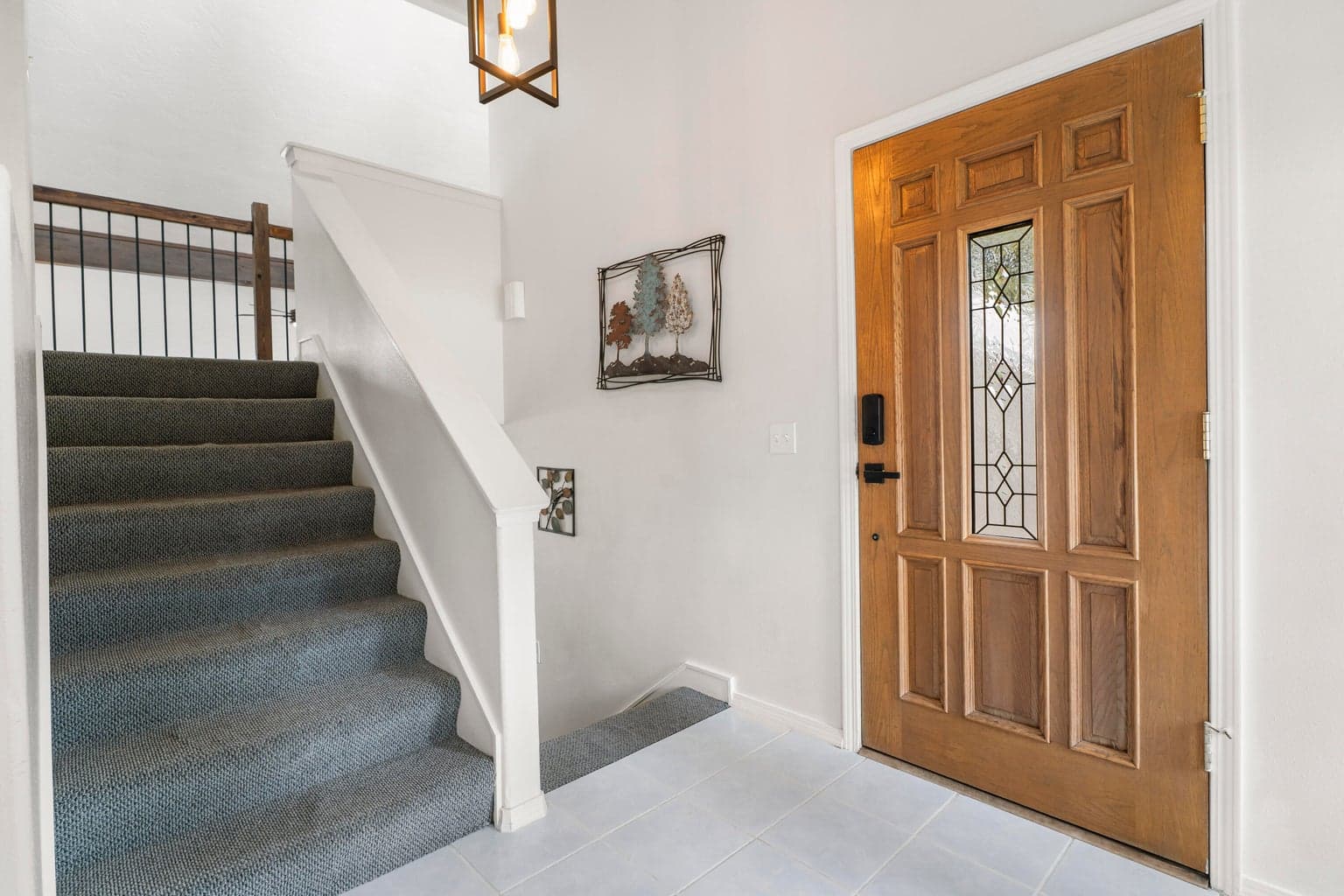 Welcoming front entry with custom timber and rebar railing detail