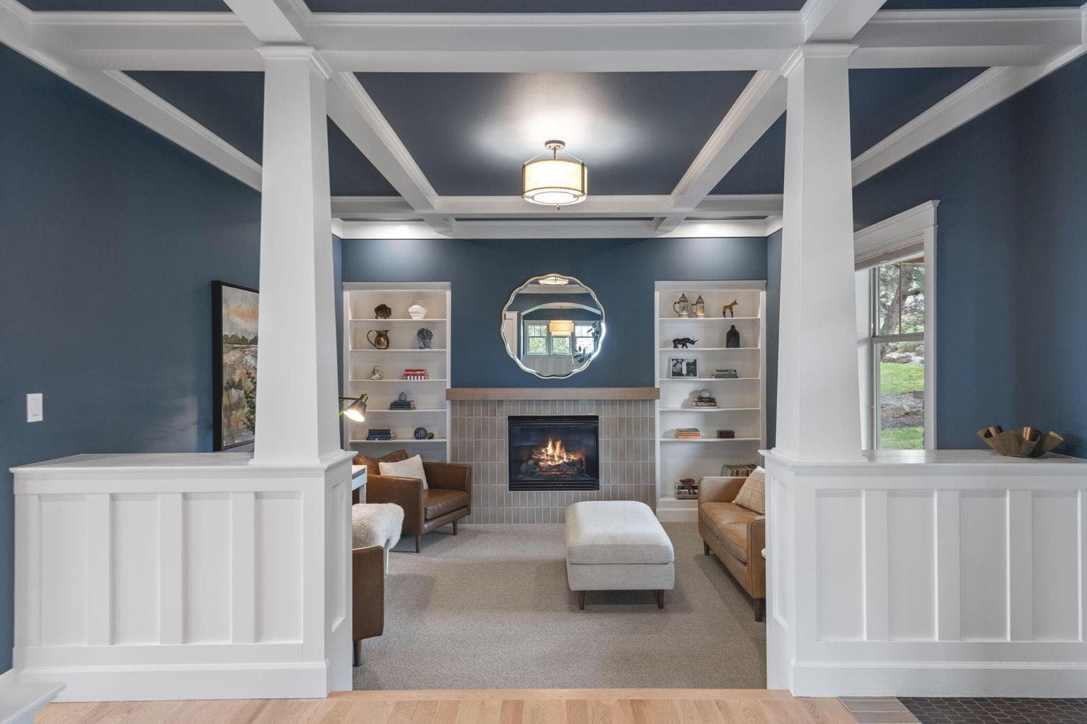 Craftsman architecture anchors the home with wainscoting, moldings, and tailored built-ins that flow seamlessly through every level. Designed for both gathering and quiet retreat, the home features a casual built-in dining nook and formal dining room, inviting connection and comfort in equal measure.