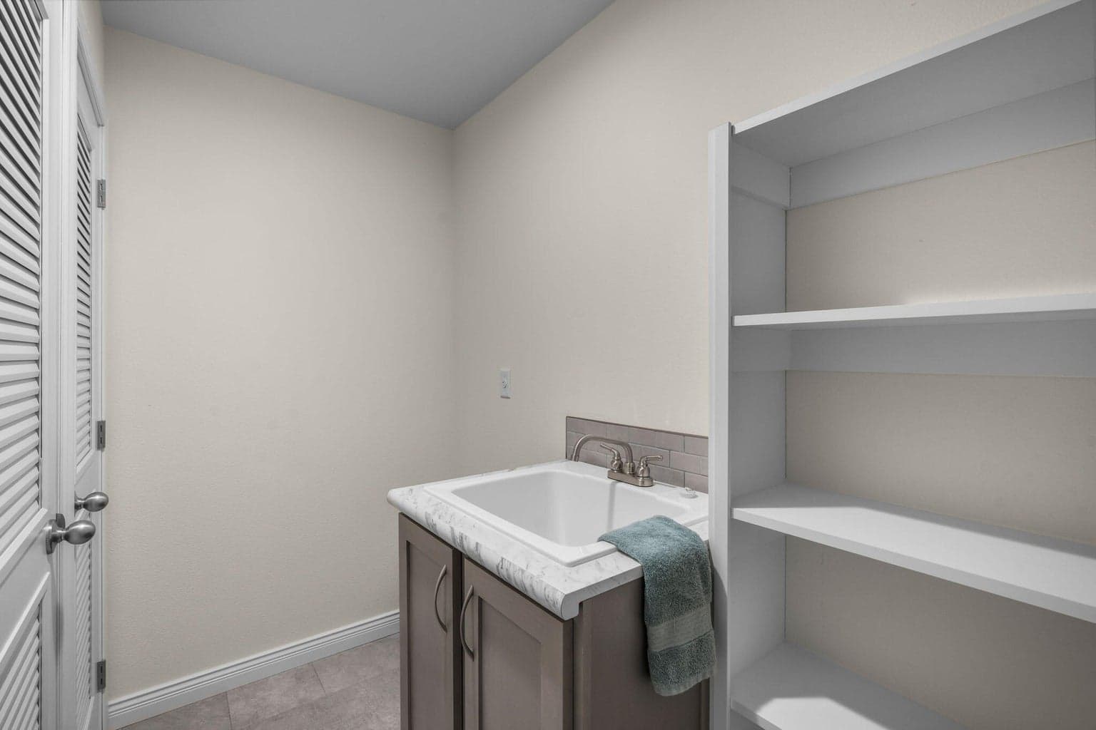 Pantry off the laundry room, wash sink and room for addtl fridge/freezer
