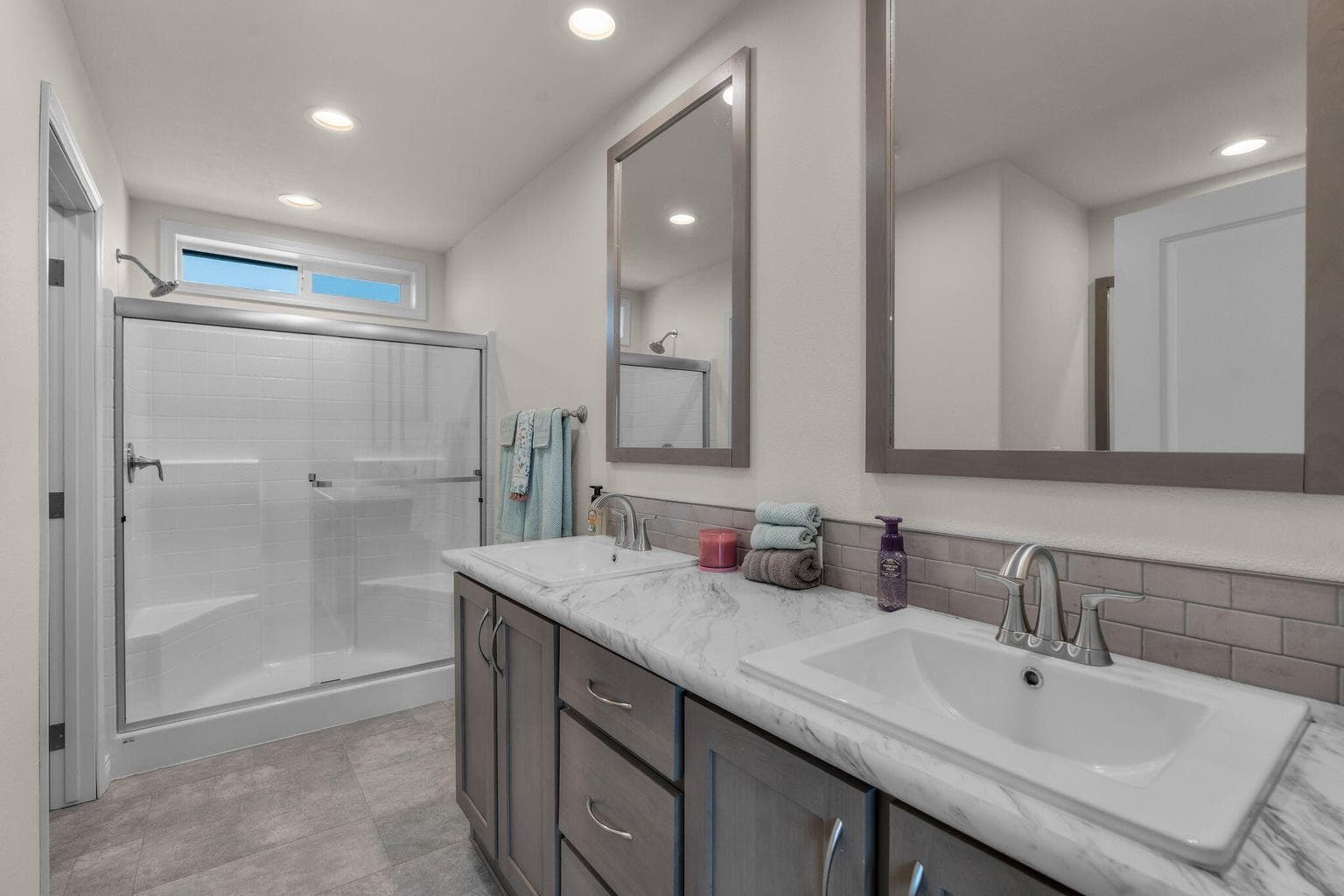 Primary bath, double vanity, wood wrapped mirrors
