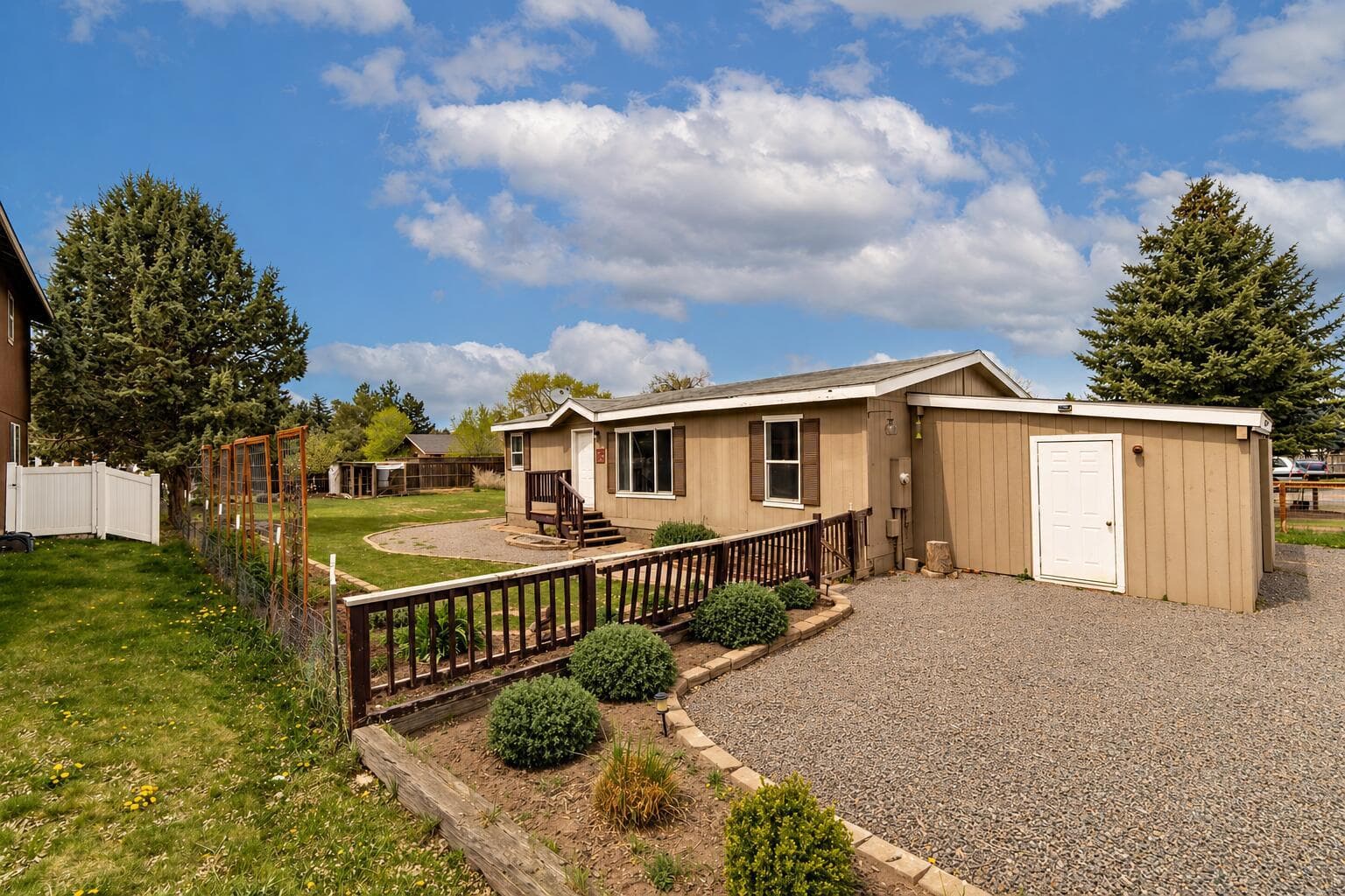 Front exterior of home and shed