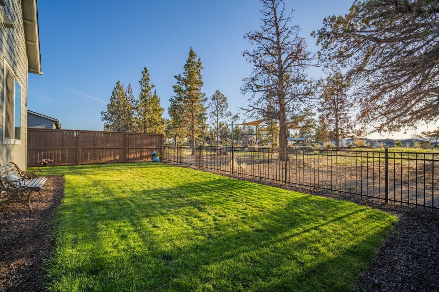 View of park + spacious back yard