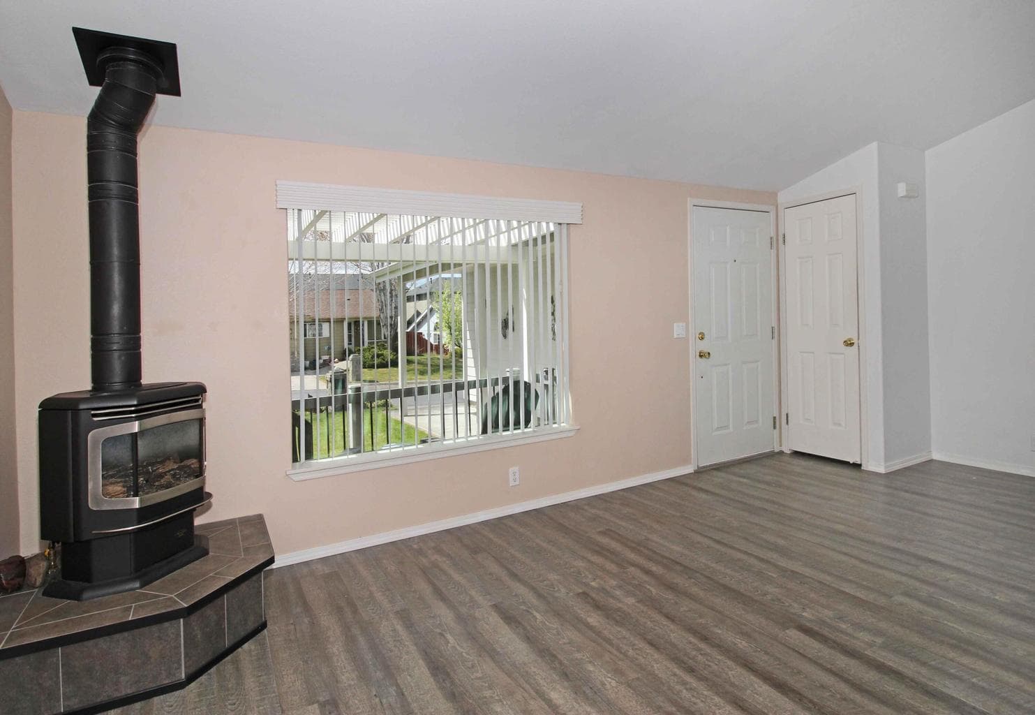 Living Room; Pergola View to Front Yard; LVP Flooring.