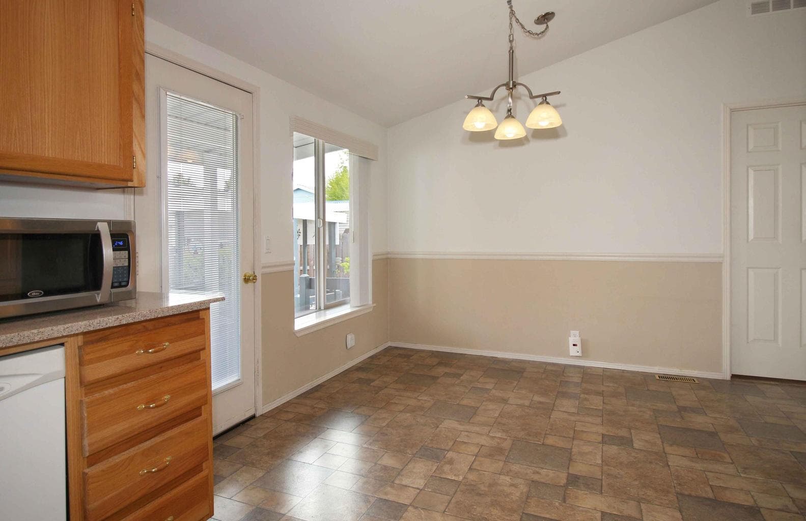 Dining area right off kitchen, and opens to covered porch.