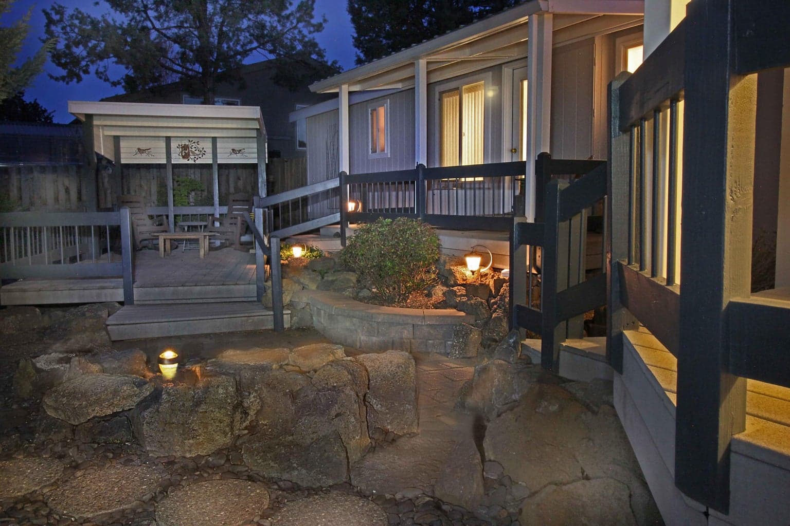 Evening atmosphere in your low maintenance back decks and porches yard.
