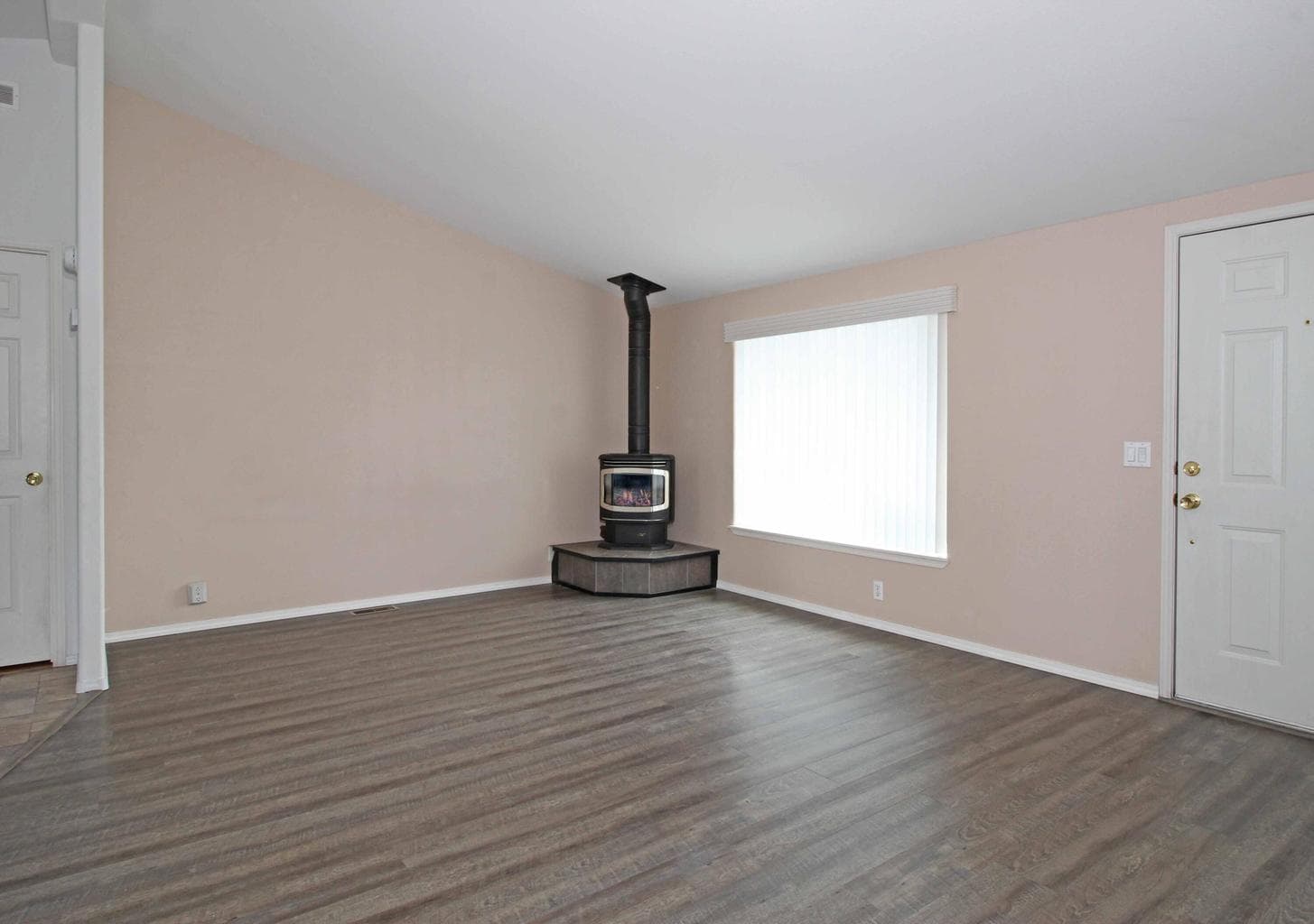 Perfect size living room with cozy gas stove.