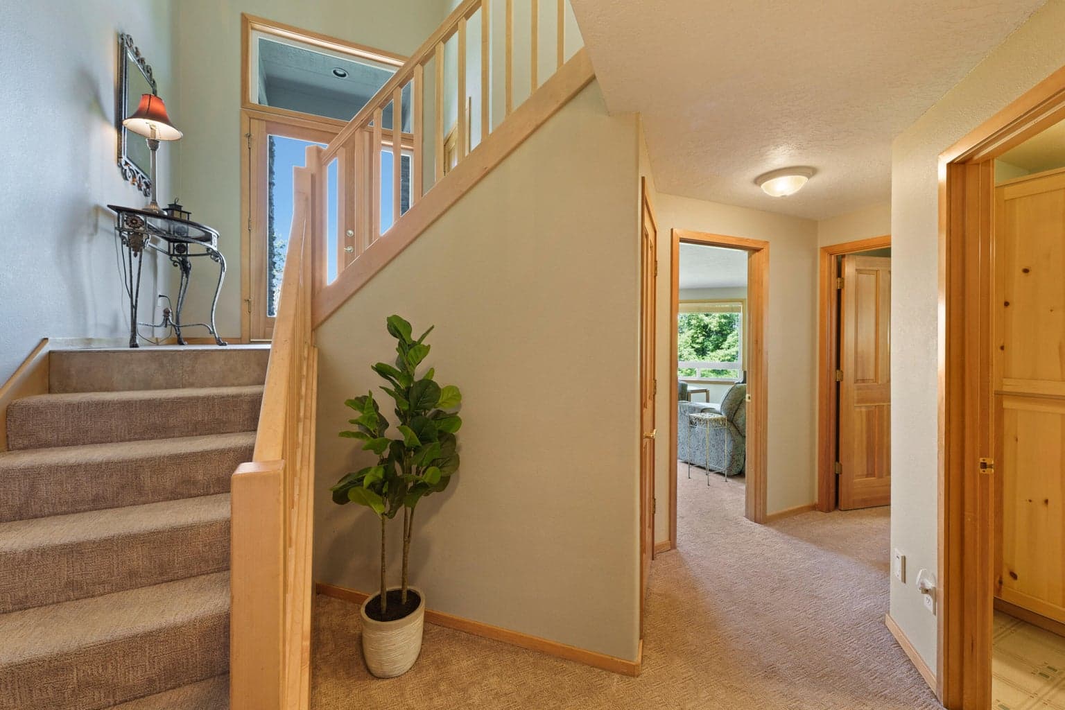Down to den, two guest rooms, guest bath, utility room and garage