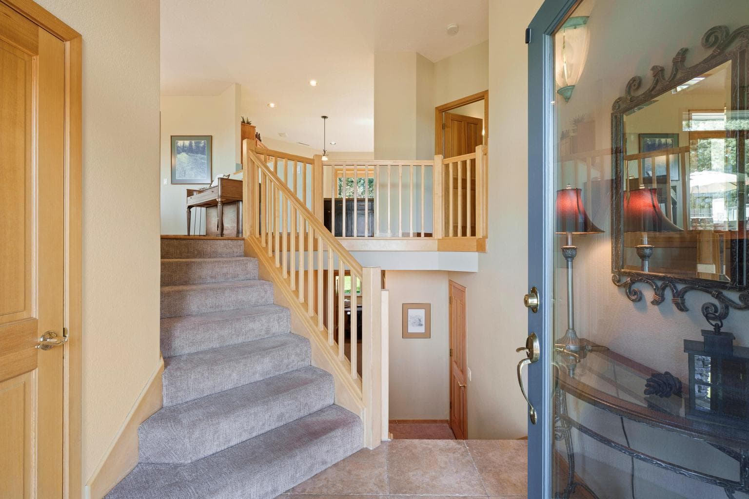 Up to main floor living, dining, kitchen, primary suite and powder room