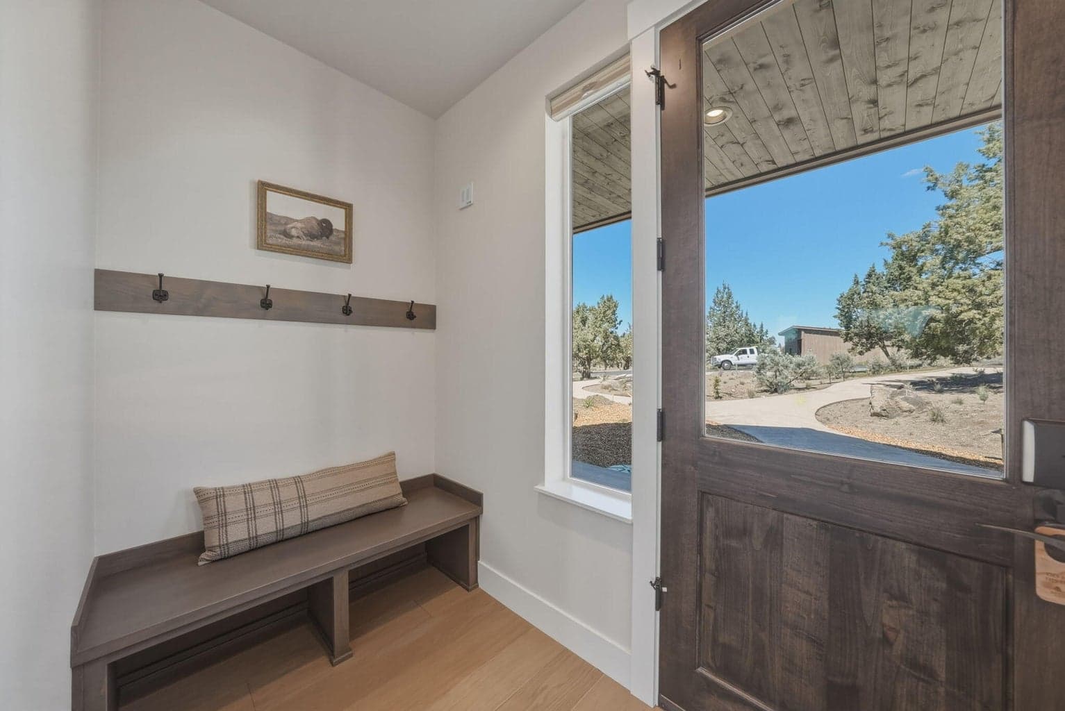 Front Entrance with washer/dryer combination in a closet here and the fifth bathroom off this hall