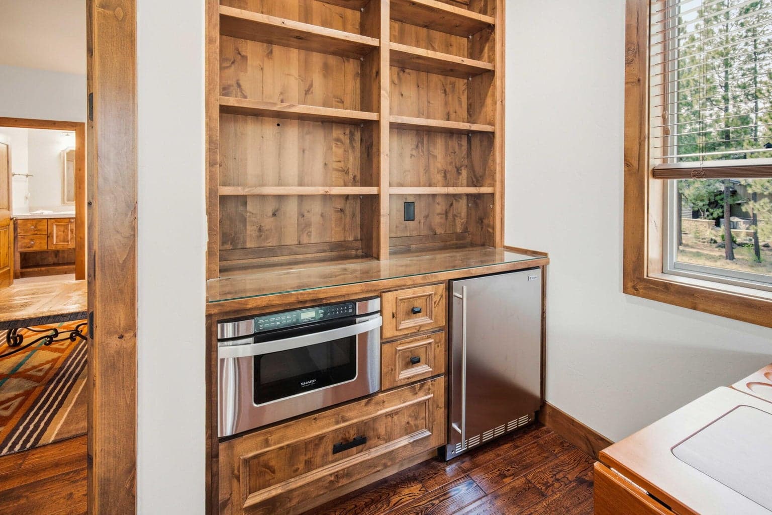 Second level flex space has a microwave and refrigerator, perfect for guests or in-law quarters!