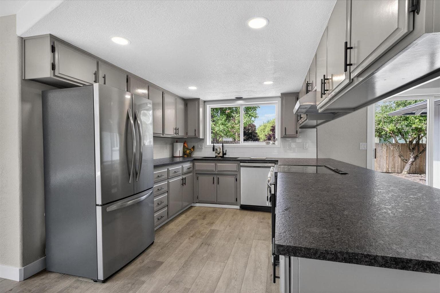 Kitchen with Upgraded Granite Counter and Stainless Appliances