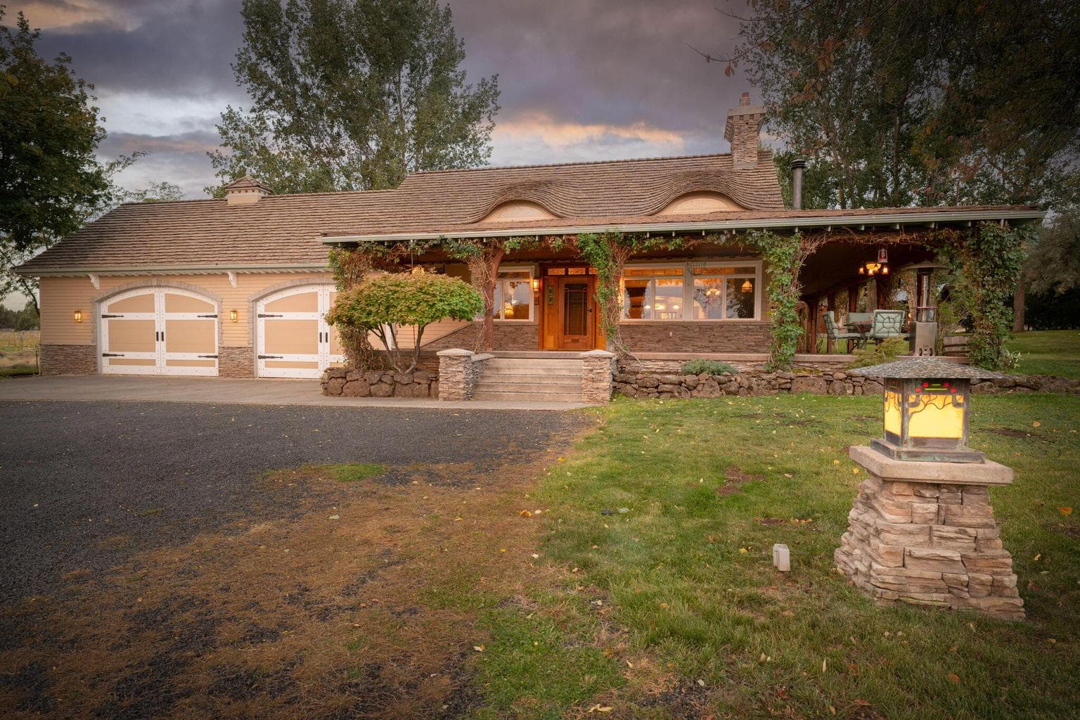Beautiful Bear Creek Ranch w/4 car garage, fully landscaped and hand forged lighting