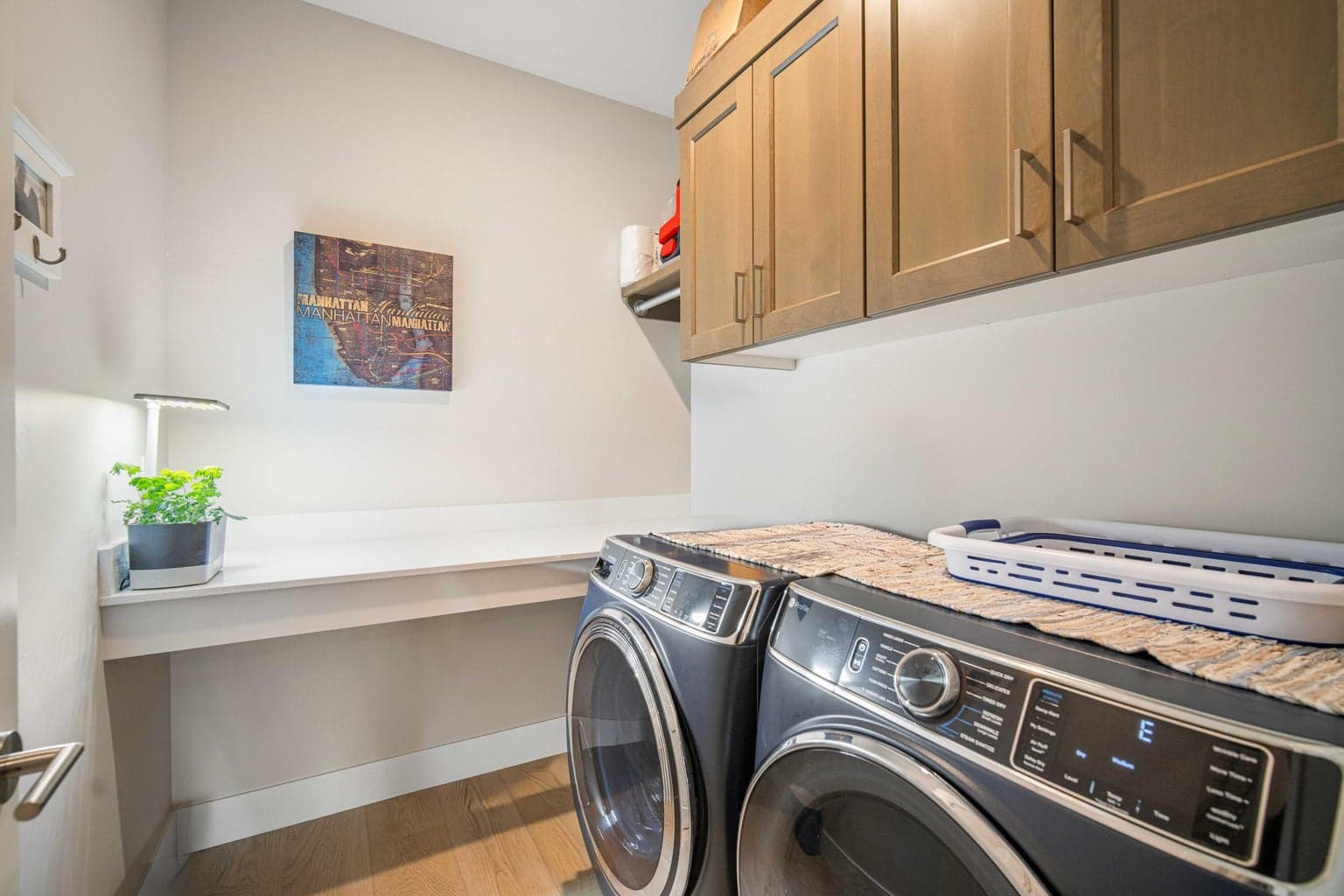 Laundry and mudroom with built in shelves/cabinets