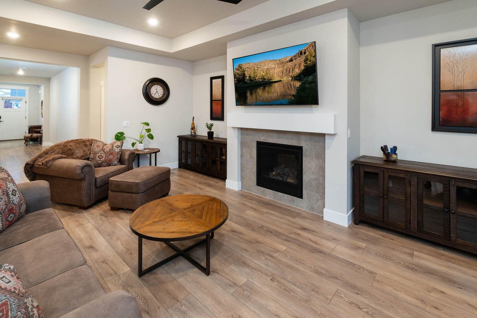 Greatroom with gas fireplace. The entry is wide and spacious.