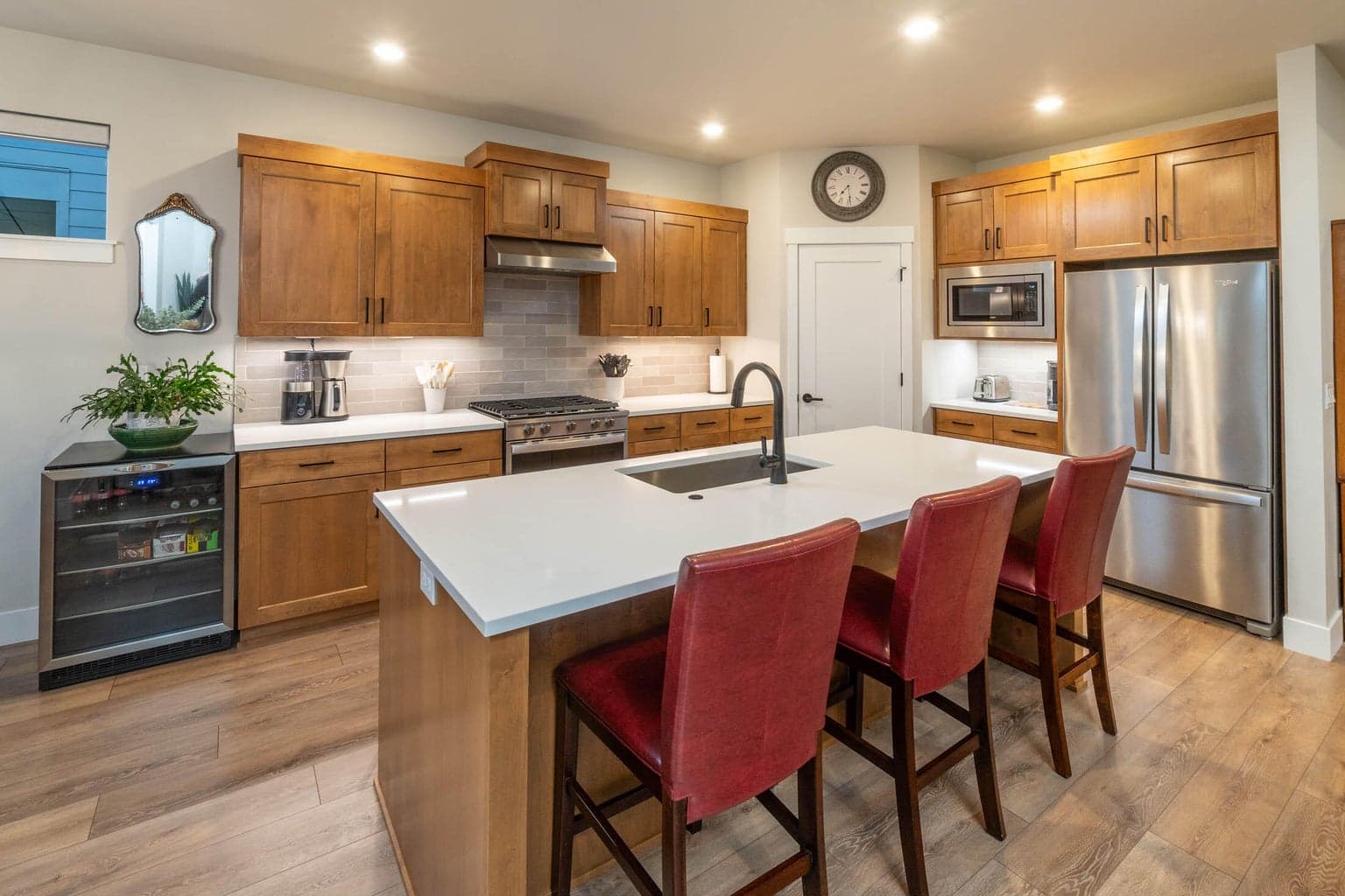 Kitchen with upgraded under-cabinet lighting. Matching main refrigerator is included.