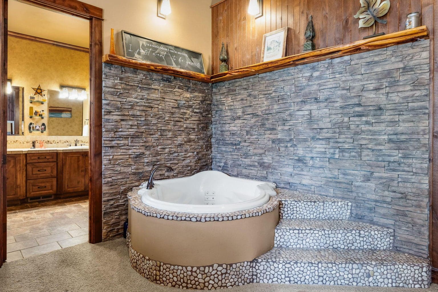 Suite like tub within primary bedroom