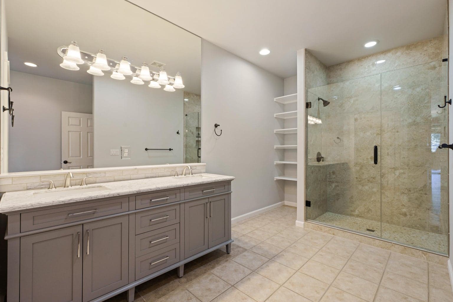 Large primary bathroom with dual sinks.