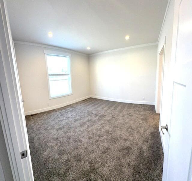 Spacious primary bedroom w/ walk-in closet and ensuite.