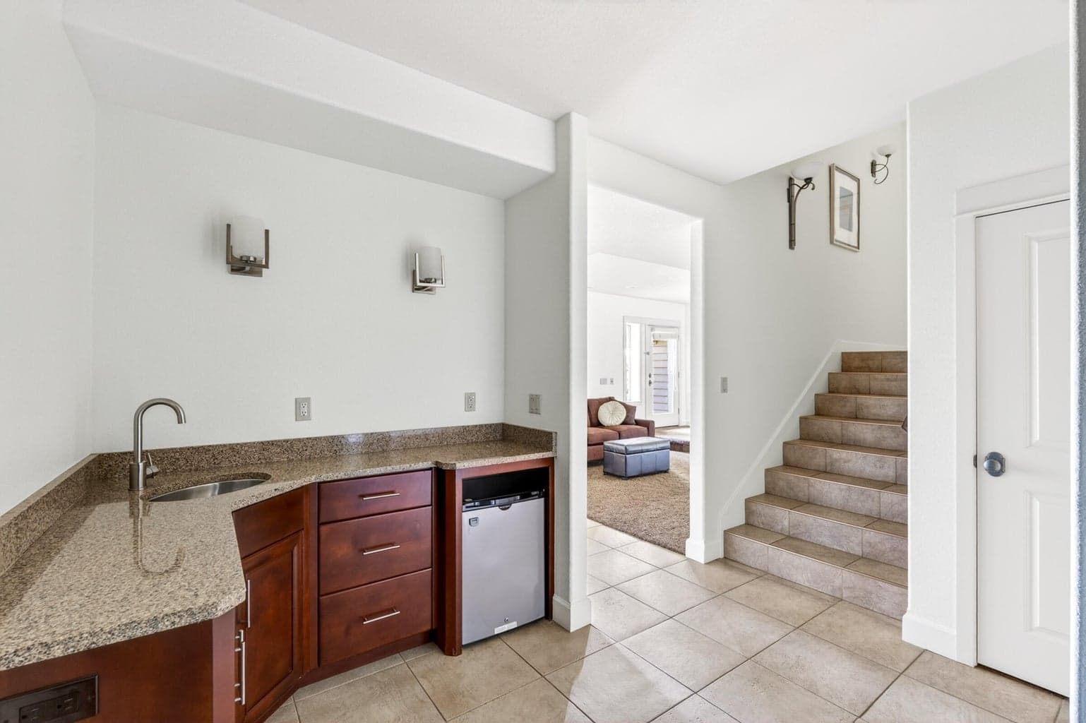 Kitchenette in the downstairs with sink and fridge