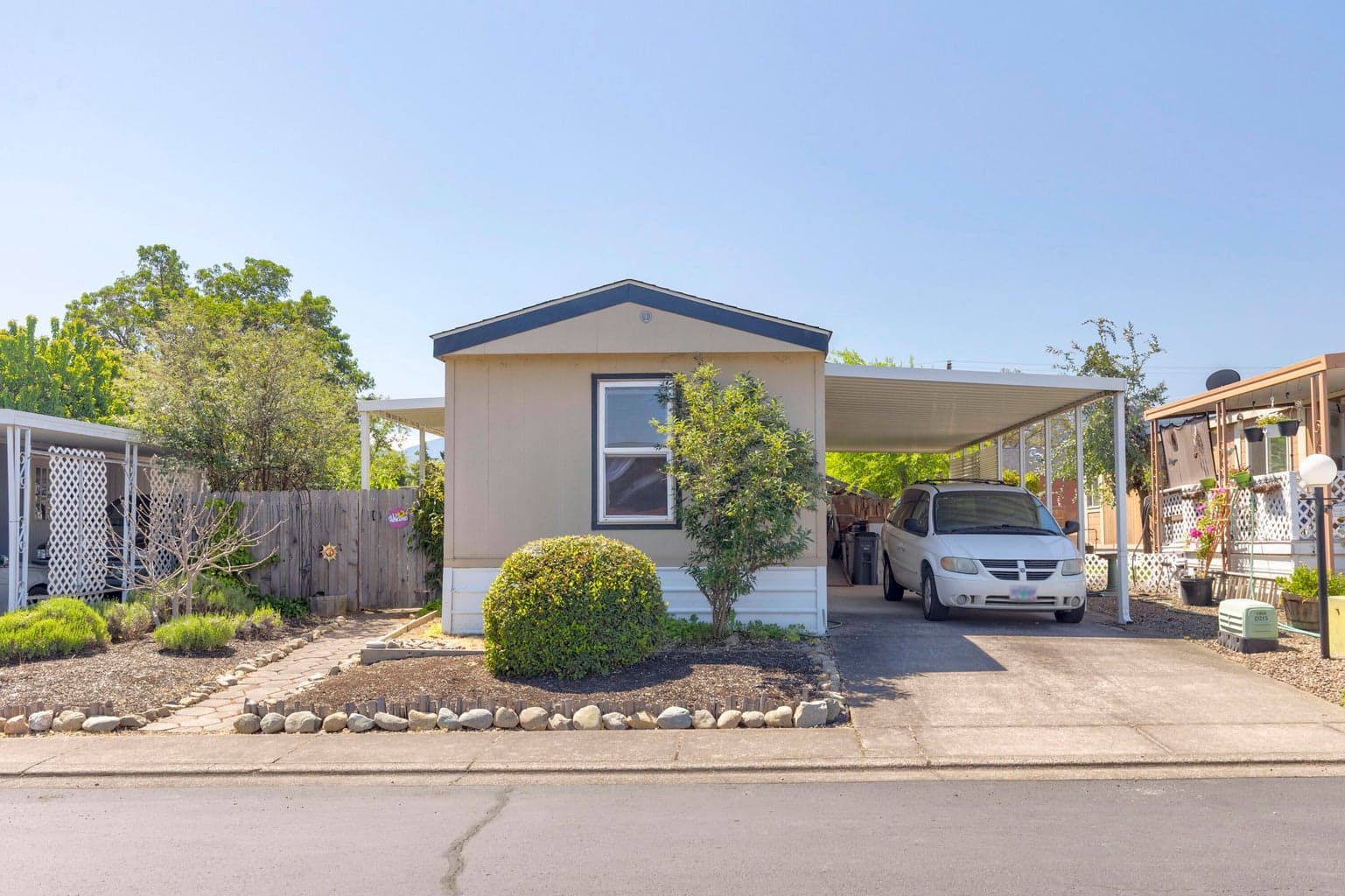 Charming, low maintenance exterior with protected parking
