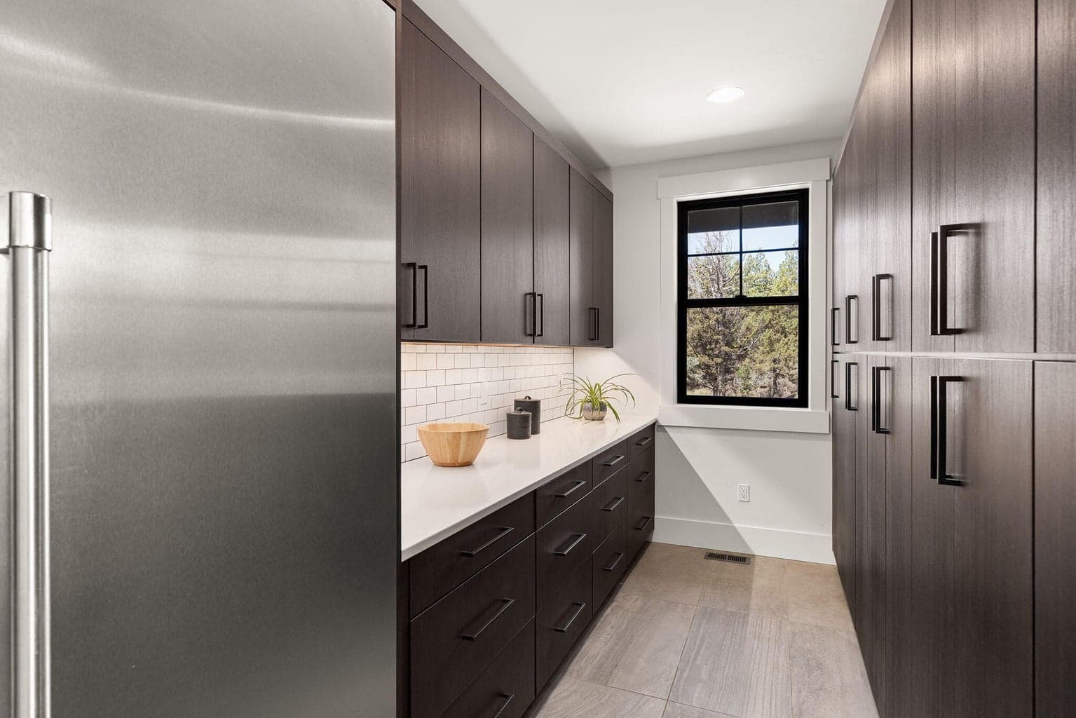 Butler's pantry with built-in Thermador freezer