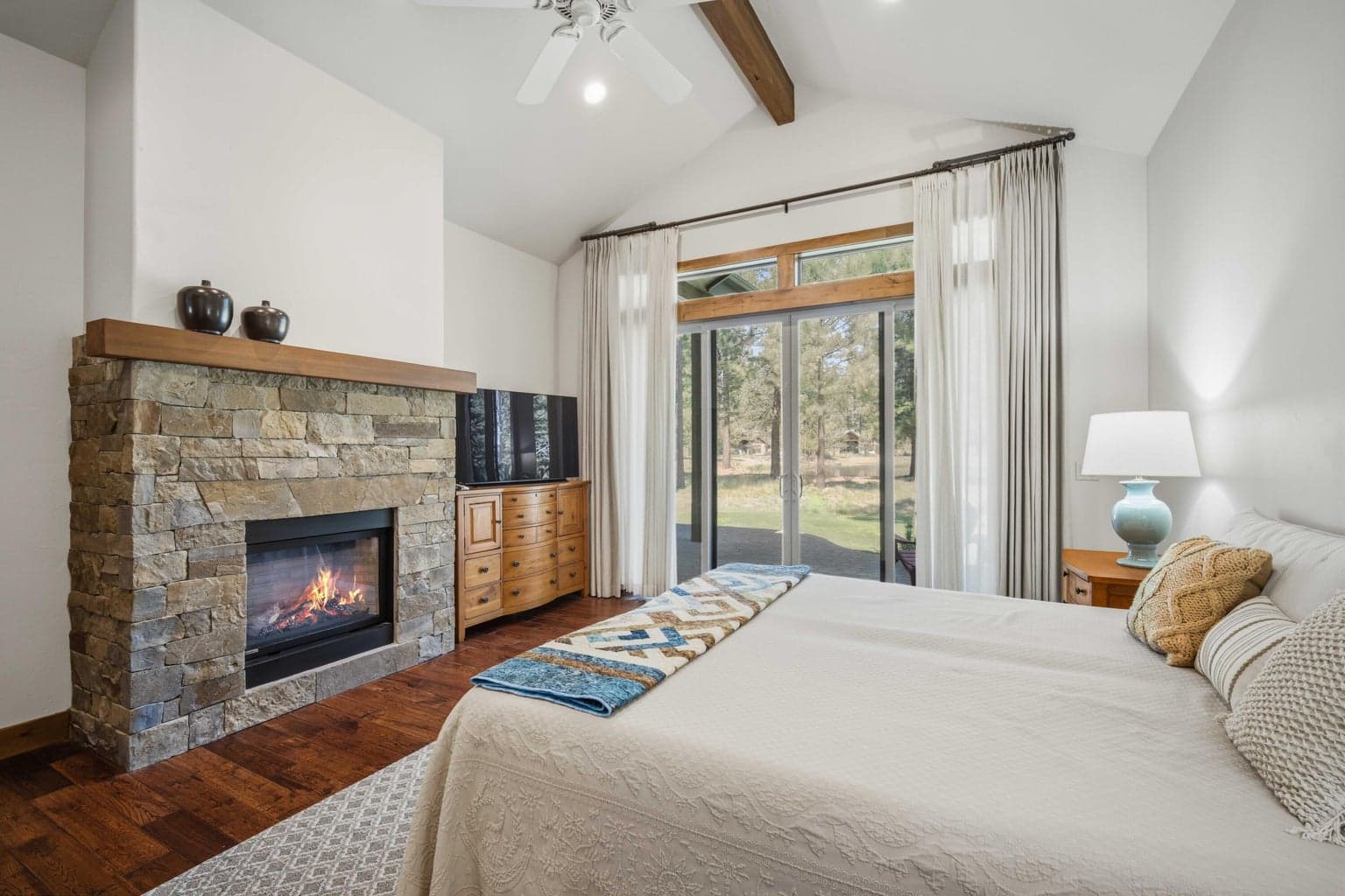 Primary bedroom complete with gas fireplace.